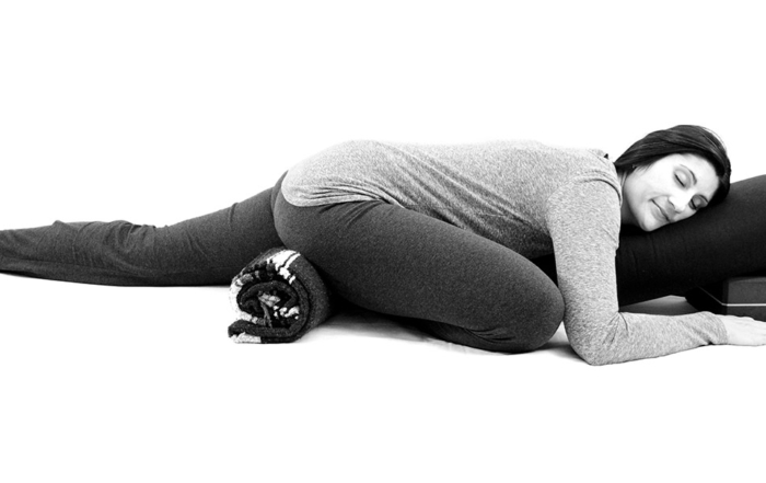 Yoga for office workers - release tension from too much sitting with supported pigeon pose