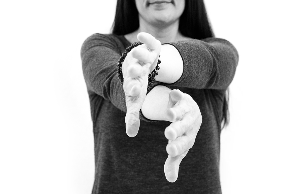 Carpal Stretches, Wrist Interlace, step three, turn palms toward each other